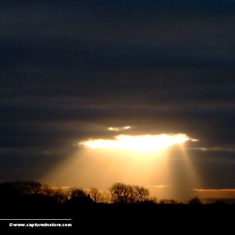 sun-breaking-through-cloud